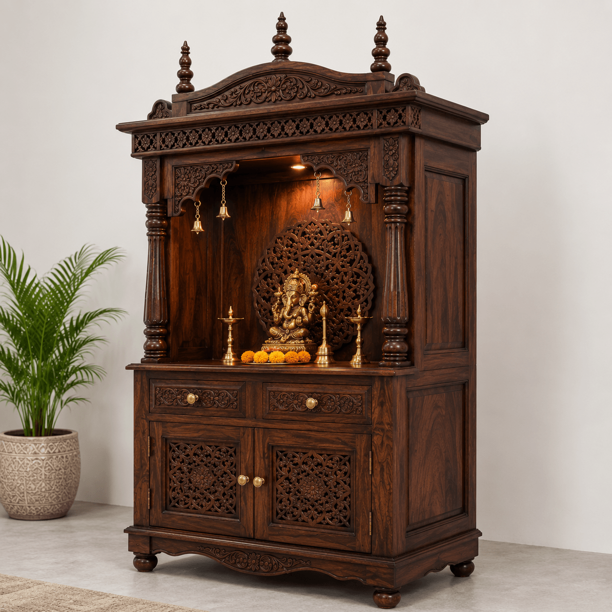 Solid mango wood handcrafted home temple with decorative carved canopy, storage drawers, and walnut finish by Bombay Home Decor LLC.
