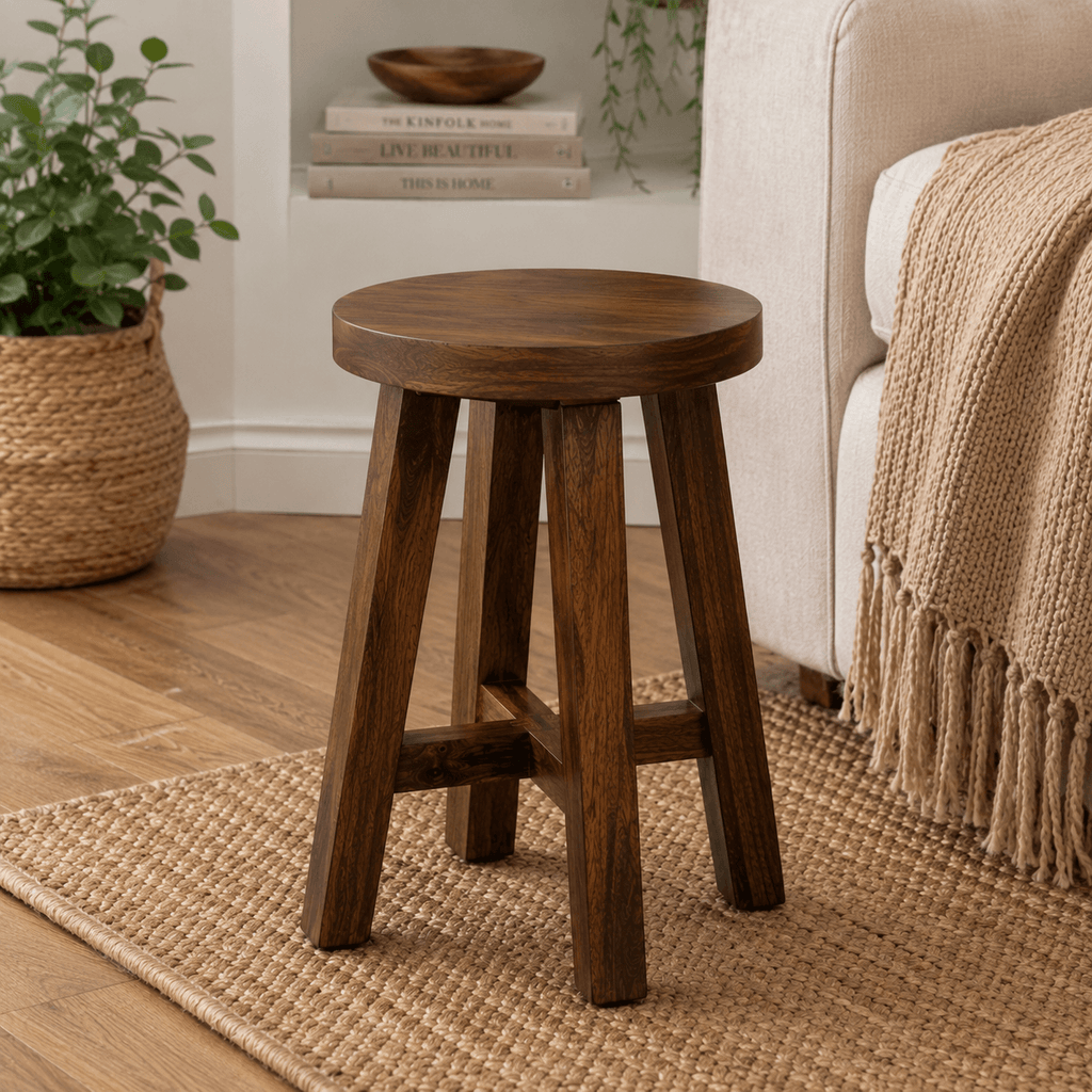 Handcrafted solid acacia wood accent stool with a round wooden seat and walnut finish by Bombay Home Decor LLC.
